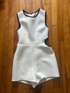 BCBG White Cutout Romper with Black Trim NWT